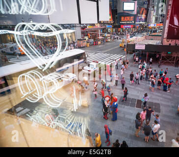 Costumed characters swarm Times Square in New York begging for tips Stock Photo