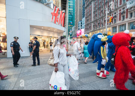 Costumed characters swarm Times Square in New York begging for tips Stock Photo