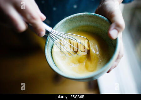 Close-up view of woman whisking Stock Photo