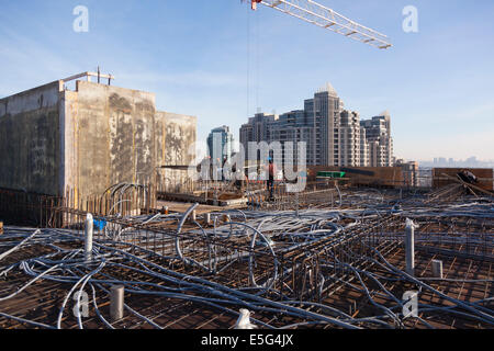 Construction workers on a rooftop construction site in Toronto, Ontario, Canada. Stock Photo
