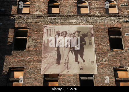 Images of former Jewish inhabitants of the Warsaw Ghetto cover the walls at Prozna Street in Warsaw Stock Photo