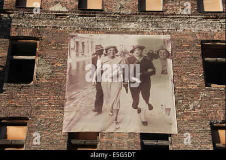 Images of former Jewish inhabitants of the Warsaw Ghetto cover the walls at Prozna Street in Warsaw Stock Photo