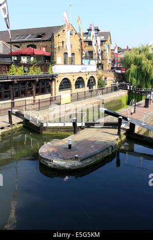 UK, London, Camden.19th Century Regent's Canal, Camden Lock & warehouses, Dingwalls rock venue (above arches) & the canal entrance to Camden Market Stock Photo