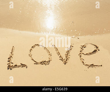 word love on the sand seashore - love and  romantic concept Stock Photo