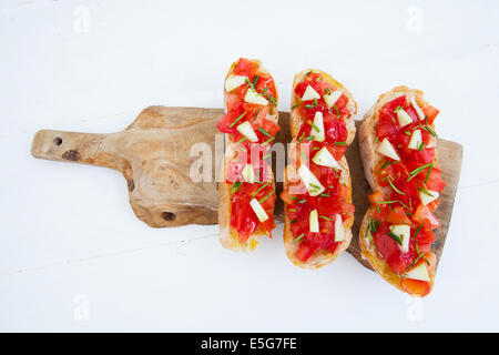 Ready to eat italian bruschetta with tomatoes and rosemary Stock Photo