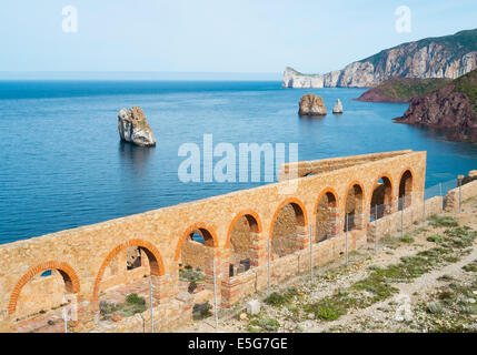 Laveria Lamarmora, an old mine building along the coast of Nebida and Masua, west coast of Sardinia, Italy Stock Photo