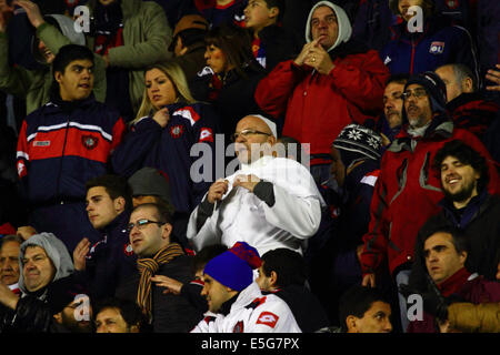 La Paz, Bolivia. 30th July, 2014.  A San Lorenzo fan dressed as Pope Francis watches his team during a second leg of a Copa Libertadores 2014 semi final match at the Hernando Siles Stadium. San Lorenzo won the first leg 5-0; Bolívar the return leg 1-0. Pope Francis is well known for his interest in football / soccer and support for the San Lorenzo team. Credit:  James Brunker / Alamy Live News Stock Photo