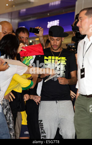 Tokyo, Japan. 31st July, 2014. Neymar Jr. arrives at Haneda International Airport on July 31, 2014, Tokyo, Japan. There were chaotic scenes in the arrivals area as approximately 700 fans many who had been waiting for hours all tried to get close to their idol. Neymar who is in Japan to promote Tokyo Nishikawa, a Japanese sleep products company, seemed happy to greet and sign autographs. Credit:  Rodrigo Reyes Marin/AFLO/Alamy Live News Stock Photo