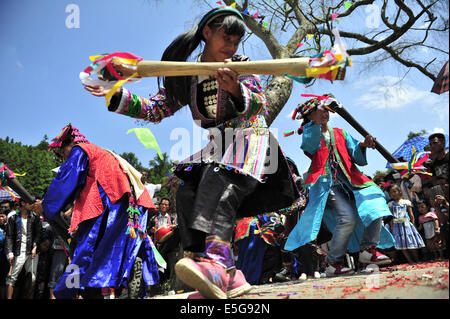 Qiandongnan, China's Guizhou Province. 30th July, 2014. People dance at the 'Naoyu' Festival in Congjiang County in Qiandongnan Miao and Dong Autonomous Perfecture, southwest China's Guizhou Province, July 30, 2014. 'Naoyu' Festival is a traditional folk custom with a history of over 450 years. People battle for live fish for the wish of harvest and happy life. © Liang Guangyuan/Xinhua/Alamy Live News Stock Photo