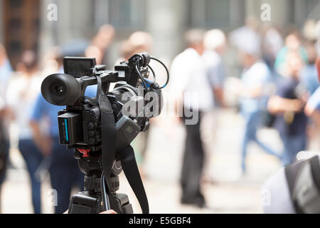 filming an event with a video camera Stock Photo