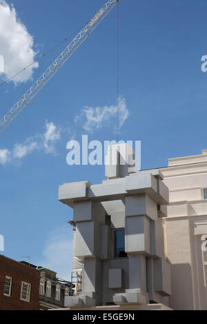 New Beaumont Hotel in London, UK. 'Room' a crouching figure by British artist Antony Gormley. Stock Photo