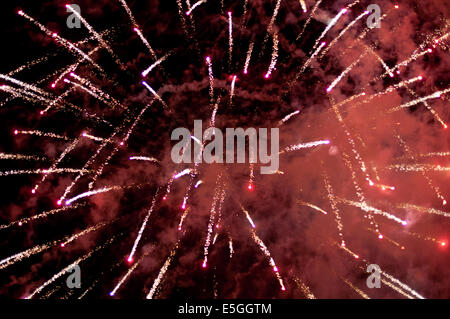 Red fireworks against night background Stock Photo