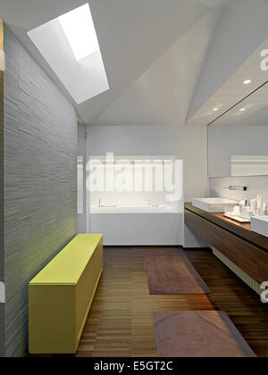 interior view of a modern bathroom in the penthouse with yellow furniture  and wood floor Stock Photo