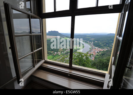 The city Koenigstein, the Lilienstein and the Elbe River, are seen through an open window in the Friedrichsburg at Koenigstein Fortress near Dresden, Germany, 31 July 2014. The walls of the fort are 1,800 meters long and up to 42 meter high. The 9.5 hectate cliff plateau rises 240 meters above the Elbe River and has 50 to 400 year old military buildings. Photo: MATTHIAS HIEKEL/dpa Stock Photo