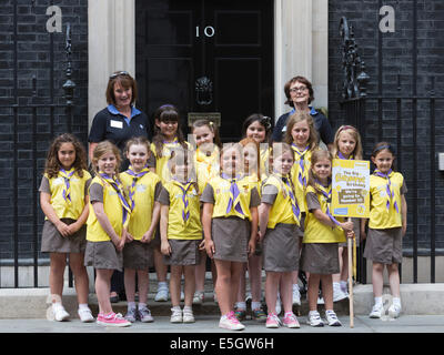 London, UK. 31 July 2014. Brownies from all over the country today visited Prime Minister David Cameron at Downing Street to celebrate the centenary of the Brownies. A Brownies group from Wales is leaving No. 10 Downing Street. Credit:  Nick Savage/Alamy Live News Stock Photo