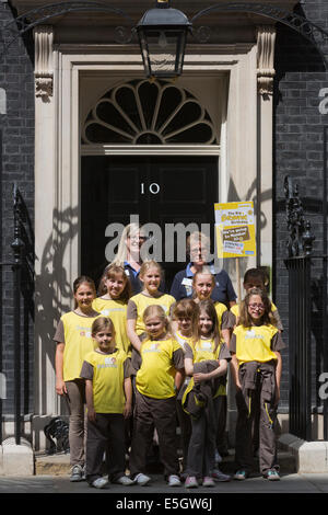 London, UK. 31 July 2014. Brownies from all over the country today visited Prime Minister David Cameron at Downing Street to celebrate the centenary of the Brownies. A Brownies group from Anglia/Essex is leaving No. 10 Downing Street. Credit:  Nick Savage/Alamy Live News Stock Photo