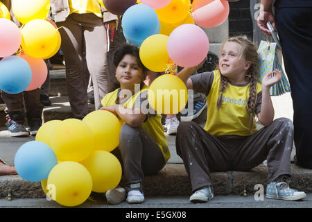 London, UK. 31 July 2014. Brownies from all over the country today visited Prime Minister David Cameron at Downing Street to celebrate the centenary of the Brownies. A Brownies group from Bradford/West Yorkshire is leaving No. 10 Downing Street. Credit:  Nick Savage/Alamy Live News Stock Photo