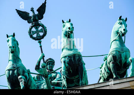 Detail of Quadriga statues on top of Brandenburg Gate in Berlin Germany Stock Photo