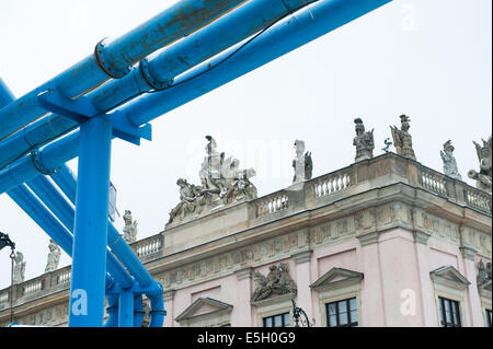 Blue above-ground water pipes in Unter den Linden (Under the Lime trees) in Berlin with Museum behind Stock Photo