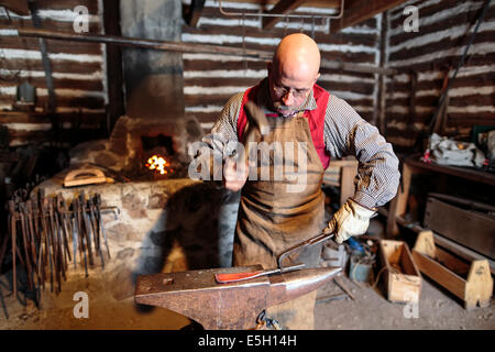 Blacksmith hammering on anvil, Festival du Voyageur, Winnipeg, Manitoba, Canada Stock Photo