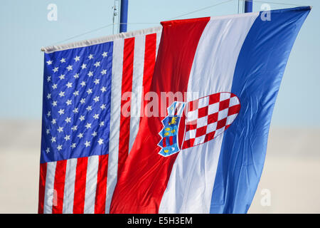 Croatian and American national flags waving on the wind. Stock Photo