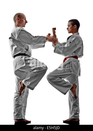 two karate men sensei and teenager student teacher teaching isolated on white background Stock Photo