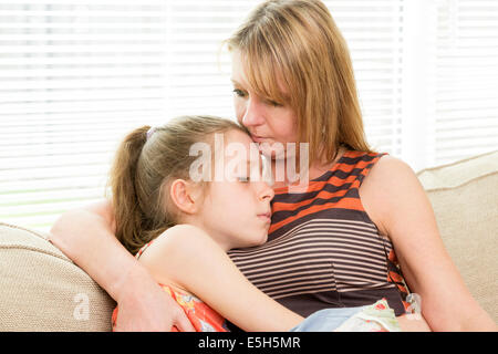 mother comforting upset child Stock Photo