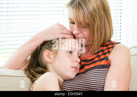 mother comforting upset child Stock Photo
