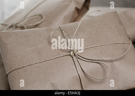 vintage style parcels wrapped with rope, close up photo Stock Photo