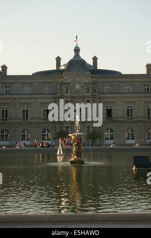 The pool in front of Palais du Luxembourg Palace at Jardin du Luxembourg Garden Paris at sunset Stock Photo