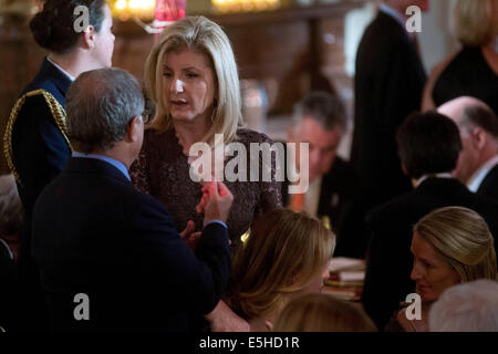 Arianna Huffington, co-founder of the Huffington Post and chair, president and editor-in-chief of the AOL Huffington Post Media Group, talks to an attendee at an event titled 'A Celebration of Special Olympics and A Unified Generation' to mark the anniversary of the Special Olympics in the East Room of the White House in Washington, DC, U.S., on Thursday, July 31, 2014. Founded in 1968 by Eunice Kennedy Shriver, the Special Olympics movement has grown to more than 4.4 million athletes in 170 countries. Credit: Andrew Harrer/Pool via CNP - NO WIRE SERVICE - Stock Photo