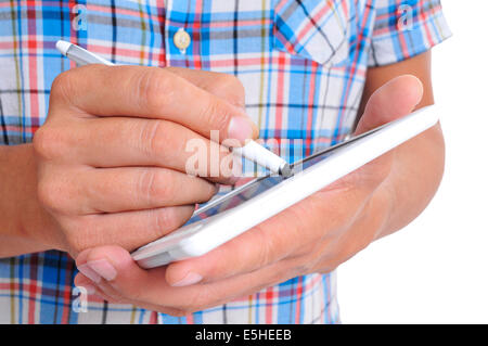 a young man using a stylus pen in his tablet Stock Photo
