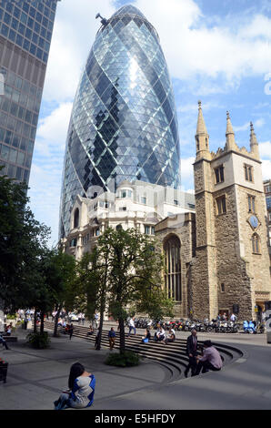 London, UK, 31 July 2014, The Norman Foster designed tower at 30 St Mary Axe in the heart of London's finincial area, nicknamed The Gherkin for its distinctive  shape, was put into bankruptcy protection last year. Deloitte Real Estate and Savills expect interest in the building to come from all over the world. The building is expected to sell for over £650 million. Stock Photo