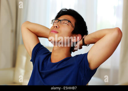 Asian man relaxing at home Stock Photo