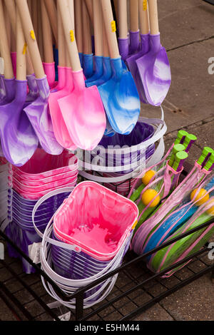 UK, England, Lincolnshire, Cleethorpes, colourful plastic buckets and spades for sale at seafront stall Stock Photo