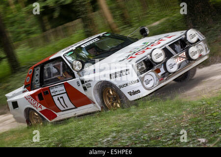 1985 Toyota Celica Twin-Cam Turbo with driver Bjorn Waldegard. Forest stage at the 2014 Goodwood Festival of Speed, Sussex, UK. Stock Photo