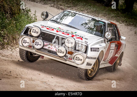 1985 Toyota Celica Twin-Cam Turbo with driver Bjorn Waldegard. Forest stage at the 2014 Goodwood Festival of Speed, Sussex, UK. Stock Photo