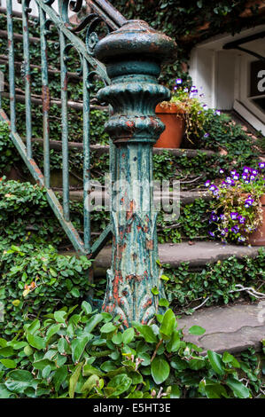 Ornate and antique ivy laden staircase Stock Photo