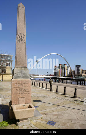 Memorial to John Wesley near the Gateshead Millennium Bridge over the River Tyne, and Baltic Centre for Contemporary Arts. Stock Photo
