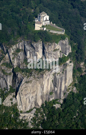 AERIAL VIEW. Sanctuary perched on a clifftop. Madonna del Sasso Sanctuary, Boleto, Lake Orta, Piedmont, Italy. Stock Photo