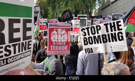 London, UK. 1st Aug, 2014. An array of placards seen during the demonstration on Kensington road. Credit: David Mbiyu/ Alamy Live News Stock Photo