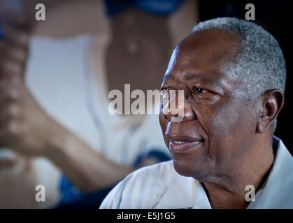 FILE – In this April 8, 1974, file photo, Atlanta Braves' Hank Aaron holds  aloft the ball he hi …