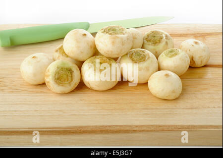 turnip on wooden kitchen board Stock Photo