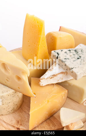 Various Types of Cheese on a Cutting Board Stock Photo