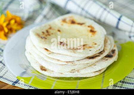 homemade fresh baked pitas on the table Stock Photo