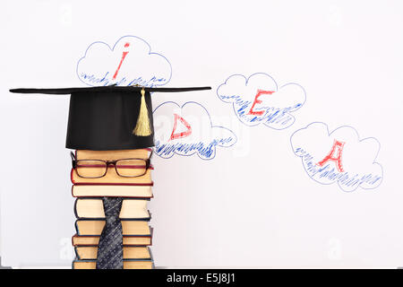 Unusual student parody on a background of idea word in clouds Stock Photo