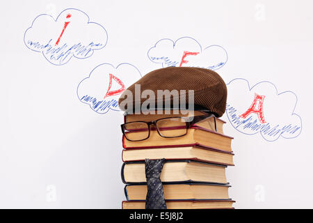 Unusual student parody on a background of idea word in clouds Stock Photo