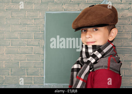 Education idea, the schoolboy before the open door represented on a chalkboard Stock Photo