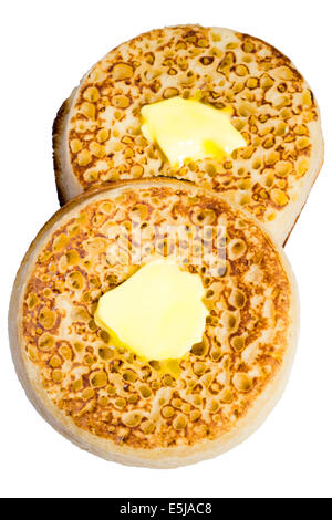 Two toasted crumpets cut out or isolated against a white background. Stock Photo