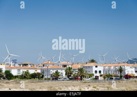 Group of wind turbines behind an urbanisation of Zahara de los atunes. Cadiz, Andalusia, Spain. Stock Photo